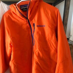 Light Use Patagonia puff hoodie. Wrist slight tear that could be stitched